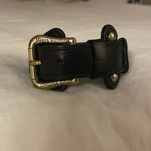 Louis Vuitton Black leather and gold bracelet.